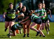 13 April 2024; Avril Whittle of Portdara is tackled by Sophie Cullen, left, and Sophie Francis of Naas during the Leinster Rugby Girl's U18 semi-final match between Naas and Portdara at Naas RFC in Kildare. Photo by Tyler Miller/Sportsfile