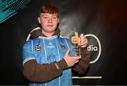 18 April 2024; JP Sleator of UCD poses for a photograph with the trophy after the Virgin Media ELOI Finals at The Camden Sports Bar in Dublin. Photo by Tyler Miller/Sportsfile