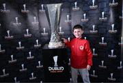 19 April 2024; Jacob O'Toole, from Lucan, poses with the UEFA Europa League trophy in the ground before the SSE Airtricity Men's Premier Division match between St Patrick's Athletic and Waterford at Richmond Park in Dublin. Photo by Piaras Ó Mídheach/Sportsfile