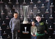 19 April 2024; AJ, Sadie and Jack Delaney, from Clondalkin, pose with the UEFA Europa League trophy in the ground before the SSE Airtricity Men's Premier Division match between St Patrick's Athletic and Waterford at Richmond Park in Dublin. Photo by Piaras Ó Mídheach/Sportsfile