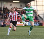 19 April 2024; Richie Towell of Shamrock Rovers in action against Ronan Boyce of Derry City during the SSE Airtricity Men's Premier Division match between Derry City and Shamrock Rovers at the Ryan McBride Brandywell Stadium in Derry. Photo by Stephen McCarthy/Sportsfile
