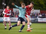 19 April 2024; Mason Melia of St Patrick's Athletic in action against Rowan McDonald of Waterford during the SSE Airtricity Men's Premier Division match between St Patrick's Athletic and Waterford at Richmond Park in Dublin. Photo by Piaras Ó Mídheach/Sportsfile