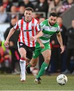 19 April 2024; Ben Doherty of Derry City in action against Roberto Lopes of Shamrock Rovers during the SSE Airtricity Men's Premier Division match between Derry City and Shamrock Rovers at the Ryan McBride Brandywell Stadium in Derry. Photo by Stephen McCarthy/Sportsfile