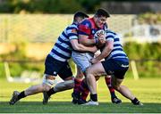 19 April 2024; Dylan Lynch of Clontarf FC is tackled by Jack Gardiner, left, and Emmett Burns of Blackrock College RFC during the Bank of Ireland Leinster Rugby Metropolitan Cup final match between Blackrock College RFC and Clontarf FC at Old Belvedere RFC, in Ollie Campbell Park, Dublin. Photo by Tyler Miller/Sportsfile