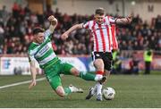19 April 2024; Ronan Boyce of Derry City in action against Markus Poom of Shamrock Rovers during the SSE Airtricity Men's Premier Division match between Derry City and Shamrock Rovers at the Ryan McBride Brandywell Stadium in Derry. Photo by Stephen McCarthy/Sportsfile