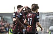 19 April 2024; James Akintunde of Bohemians, centre, celebrates with teammates after scoring his side's first goal during the SSE Airtricity Men's Premier Division match between Bohemians and Drogheda United at Dalymount Park in Dublin. Photo by Shauna Clinton/Sportsfile