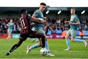19 April 2024; Hayden Cann of Drogheda United is tackled by James Akintunde of Bohemians during the SSE Airtricity Men's Premier Division match between Bohemians and Drogheda United at Dalymount Park in Dublin. Photo by Shauna Clinton/Sportsfile