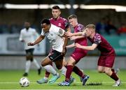 19 April 2024; Success Edogun of Finn Harps in action against Cobh Ramblers players, from left, David Bosnjak, Jason Abbott, and Cian Browne during the SSE Airtricity Men's First Division match between Cobh Ramblers and Finn Harps at St Coleman's Park in Cobh, Cork. Photo by Michael P Ryan/Sportsfile