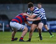 19 April 2024; Alex Mullan of Blackrock College RFC is tackled by Paul Deeny of Clontarf FC during the Bank of Ireland Leinster Rugby Metropolitan Cup final match between Blackrock College RFC and Clontarf FC at Old Belvedere RFC, in Ollie Campbell Park, Dublin. Photo by Tyler Miller/Sportsfile