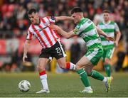 19 April 2024; Danny Mullen of Derry City in action against Josh Honohan of Shamrock Rovers during the SSE Airtricity Men's Premier Division match between Derry City and Shamrock Rovers at the Ryan McBride Brandywell Stadium in Derry. Photo by Stephen McCarthy/Sportsfile