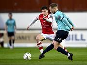 19 April 2024; Rowan McDonald of Waterford in action against Kian Leavy of St Patrick's Athletic during the SSE Airtricity Men's Premier Division match between St Patrick's Athletic and Waterford at Richmond Park in Dublin. Photo by Piaras Ó Mídheach/Sportsfile