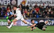 19 April 2024; Ethan McIlroy of Ulster evades the tackle of Mason Grady of Cardiff during the United Rugby Championship match between Ulster and Cardiff at the Kingspan Stadium in Belfast. Photo by Ramsey Cardy/Sportsfile