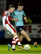 19 April 2024; Chris Forrester of St Patrick's Athletic in action against Harvey Macadam of Waterford during the SSE Airtricity Men's Premier Division match between St Patrick's Athletic and Waterford at Richmond Park in Dublin. Photo by Piaras Ó Mídheach/Sportsfile