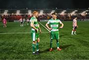 19 April 2024; Rory Gaffney, left, and Dylan Watts of Shamrock Rovers look on as the game is paused due to items being thrown in the direction of the Shamrock Rovers supporters from outside the Ryan McBride Brandywell Stadium during the SSE Airtricity Men's Premier Division match between Derry City and Shamrock Rovers at the Ryan McBride Brandywell Stadium in Derry. Photo by Stephen McCarthy/Sportsfile