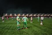 19 April 2024; Rory Gaffney, left, and Dylan Watts of Shamrock Rovers look on as the game is paused due to items being thrown in the direction of the Shamrock Rovers supporters from outside the Ryan McBride Brandywell Stadium during the SSE Airtricity Men's Premier Division match between Derry City and Shamrock Rovers at the Ryan McBride Brandywell Stadium in Derry. Photo by Stephen McCarthy/Sportsfile