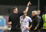 19 April 2024; Galway United manager John Caufield, right, is shown a red card by referee Damien MacGraith during the SSE Airtricity Men's Premier Division match between Galway United and Shelbourne at Eamonn Deacy Park in Galway. Photo by Sam Barnes/Sportsfile