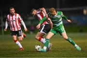 19 April 2024; Darragh Nugent of Shamrock Rovers in action against Ronan Boyce of Derry Cityduring the SSE Airtricity Men's Premier Division match between Derry City and Shamrock Rovers at the Ryan McBride Brandywell Stadium in Derry. Photo by Stephen McCarthy/Sportsfile