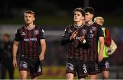 19 April 2024; Bohemians players, from left, Brian McManus, Paddy Kirk and James Clarke acknowledge supporters after their side's victory in the SSE Airtricity Men's Premier Division match between Bohemians and Drogheda United at Dalymount Park in Dublin. Photo by Shauna Clinton/Sportsfile