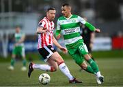 19 April 2024; Graham Burke of Shamrock Rovers in action against Shane McEleney of Derry City during the SSE Airtricity Men's Premier Division match between Derry City and Shamrock Rovers at the Ryan McBride Brandywell Stadium in Derry. Photo by Stephen McCarthy/Sportsfile