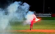 19 April 2024; A young supporter runs with a flare after it had been thrown onto the pitch during the SSE Airtricity Men's Premier Division match between Derry City and Shamrock Rovers at the Ryan McBride Brandywell Stadium in Derry. Photo by Stephen McCarthy/Sportsfile