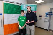 20 April 2024; John O'Shea meets 14 year old Conor Keegan from Castlebar, Mayo, while visiting with the UEFA Europa League trophy to Children’s Health Ireland at Crumlin to raise spirits for the families and children at the hospital as part of the trophy tour this week. Your support can help give children & young people the very best chance in Children's Health Ireland at Crumlin, Temple Street, Tallaght & Connolly. Donations can be made at www.childrenshealth.ie. Photo by Matt Browne/Sportsfile