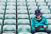 20 April 2024; A Ireland supporter read the match program prior to the Women's Six Nations Rugby Championship match between England and Ireland at Twickenham Stadium in London, England. Photo by Juan Gasparini/Sportsfile