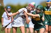 20 April 2024; Róise Hennessy of Kildare in action against Tara Burke of Kerry during the Electric Ireland Camogie Minor B All-Ireland semi-final match between Kerry and Kildare at Banagher in Offaly. Photo by Stephen Marken/Sportsfile