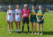 20 April 2024; From left, Kildare joint captains Sadhbh Buckley, Róise Hennessy, Referee Cathal Mc Allister, Kerry joint captains Hannah Ryan, and Ruth O'Connor before the Electric Ireland Camogie Minor B All-Ireland semi-final match between Kerry and Kildare at Banagher in Offaly. Photo by Stephen Marken/Sportsfile