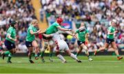 20 April 2024; Aoife Wafer of Ireland passes the ball as she is tackled by Lark Davies of England during the Women's Six Nations Rugby Championship match between England and Ireland at Twickenham Stadium in London, England. Photo by Juan Gasparini/Sportsfile