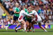 20 April 2024; Aoife Dalton of Ireland is tackled by Holly Aitchison of England during the Women's Six Nations Rugby Championship match between England and Ireland at Twickenham Stadium in London, England. Photo by Juan Gasparini/Sportsfile