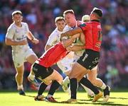20 April 2024; Ciarán Frawley of Leinster is tackled by Morne van den Berg and Erich Cronje of Emirates Lions during the United Rugby Championship match between Emirates Lions and Leinster at Emirates Airline Park in Johannesburg, South Africa. Photo by Harry Murphy/Sportsfile