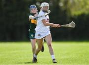 20 April 2024; Shannon Collins of Kerry in action against Sadhbh Buckley of Kildare during the Electric Ireland Camogie Minor B All-Ireland semi-final match between Kerry and Kildare at Banagher in Offaly. Photo by Stephen Marken/Sportsfile