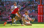 20 April 2024; Ciarán Frawley of Leinster scores his side's first try despite the tackle of Edwill van der Merwe of Emirates Lions during the United Rugby Championship match between Emirates Lions and Leinster at Emirates Airline Park in Johannesburg, South Africa. Photo by Harry Murphy/Sportsfile
