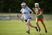 20 April 2024; Bronagh Tully of Cavan in action against Laura Flanagan of Mayoduring the Electric Ireland All-Ireland Camogie Minor B Championship semi-final 1 match between Cavan and Mayo at Duggan Park in Ballinasloe, Galway. Photo by Sam Barnes/Sportsfile
