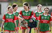 20 April 2024; Mayo players, from left, Madison Galvey, Marissa Collins and Aoibhín Greally share a joke after their side's victory in the Electric Ireland All-Ireland Camogie Minor B Championship semi-final 1 match between Cavan and Mayo at Duggan Park in Ballinasloe, Galway. Photo by Sam Barnes/Sportsfile