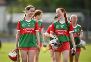 20 April 2024; Mayo players Rebekah Monaghan, left, and Éabha Delaney share a joke after their side's victory in the Electric Ireland All-Ireland Camogie Minor B Championship semi-final 1 match between Cavan and Mayo at Duggan Park in Ballinasloe, Galway. Photo by Sam Barnes/Sportsfile