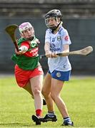 20 April 2024; Aoife Sexton of Cavan in action against Megan O'Malley of Mayo during the Electric Ireland All-Ireland Camogie Minor B Championship semi-final 1 match between Cavan and Mayo at Duggan Park in Ballinasloe, Galway. Photo by Sam Barnes/Sportsfile