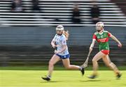 20 April 2024; Sarah Maloney of Cavan in action against Marissa Collins of Mayo during the Electric Ireland All-Ireland Camogie Minor B Championship semi-final 1 match between Cavan and Mayo at Duggan Park in Ballinasloe, Galway. Photo by Sam Barnes/Sportsfile