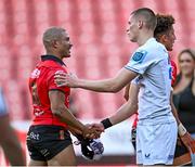 20 April 2024; Sam Prendergast of Leinster shakes hands with Edwill van der Merwe of Emirates Lions after the United Rugby Championship match between Emirates Lions and Leinster at Emirates Airline Park in Johannesburg, South Africa. Photo by Harry Murphy/Sportsfile