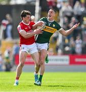 20 April 2024; Joe O'Connor of Kerry is tackled by Colm O'Callaghan of Cork during the Munster GAA Football Senior Championship semi-final match between Kerry and Cork at Fitzgerald Stadium in Killarney, Kerry. Photo by Brendan Moran/Sportsfile