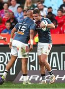 20 April 2024; Simon Zebo of Munster, left, congratulates Shane Daly of Munster after scoring his side's opening try during the United Rugby Championship match between Vodacom Bulls and Munster at Loftus Versfeld Stadium in Pretoria, South Africa. Photo by Shaun Roy/Sportsfile