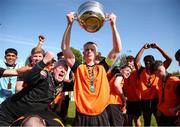 20 April 2024; St Kevin’s FC captain Logan O'Connell lifts the cup after the FAI Youth Cup final match between St Kevin’s FC, DDSL, and Pike Rovers, Limerick District League at Home Farm FC in Dublin. Photo by Michael P Ryan/Sportsfile