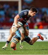 20 April 2024; Calvin Nash of Munster is tackled by Vodacom Bulls captain Elrigh Louw during the United Rugby Championship match between Vodacom Bulls and Munster at Loftus Versfeld Stadium in Pretoria, South Africa. Photo by Shaun Roy/Sportsfile