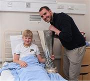 20 April 2024; John O'Shea meets 12 year old Dominykas Dzianquene, while visiting with the UEFA Europa League trophy to Children’s Health Ireland at Crumlin to raise spirits for the families and children at the hospital as part of the trophy tour this week. Your support can help give children & young people the very best chance in Children's Health Ireland at Crumlin, Temple Street, Tallaght & Connolly. Donations can be made at www.childrenshealth.ie. Photo by Matt Browne/Sportsfile