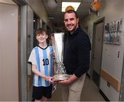20 April 2024; John O'Shea meets 15 year old Senan Byrne from Wicklow, while visiting with the UEFA Europa League trophy to Children’s Health Ireland at Crumlin to raise spirits for the families and children at the hospital as part of the trophy tour this week. Your support can help give children & young people the very best chance in Children's Health Ireland at Crumlin, Temple Street, Tallaght & Connolly. Donations can be made at www.childrenshealth.ie. Photo by Matt Browne/Sportsfile