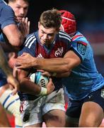 20 April 2024; Jack Crowley of Munster attempts to break the tackle during the United Rugby Championship match between Vodacom Bulls and Munster at Loftus Versfeld Stadium in Pretoria, South Africa. Photo by Shaun Roy/Sportsfile