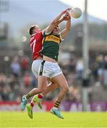 20 April 2024; Sean O'Shea of Kerry and Sean Meehan of Cork contest a kickout during the Munster GAA Football Senior Championship semi-final match between Kerry and Cork at Fitzgerald Stadium in Killarney, Kerry. Photo by Brendan Moran/Sportsfile