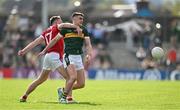 20 April 2024; Sean O'Shea of Kerry is tackled by Sean Meehan of Cork during the Munster GAA Football Senior Championship semi-final match between Kerry and Cork at Fitzgerald Stadium in Killarney, Kerry. Photo by Brendan Moran/Sportsfile