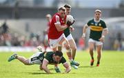 20 April 2024; Brian Hurley of Cork is tackled by Daniel O'Mahony of Cork during the Munster GAA Football Senior Championship semi-final match between Kerry and Cork at Fitzgerald Stadium in Killarney, Kerry. Photo by Brendan Moran/Sportsfile
