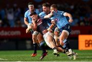 20 April 2024; Calvin Nash of Munster is tackled by Ruan Vermaak and Willie le Roux of Vodacom Bulls during the United Rugby Championship match between Vodacom Bulls and Munster at Loftus Versfeld Stadium in Pretoria, South Africa. Photo by Shaun Roy/Sportsfile